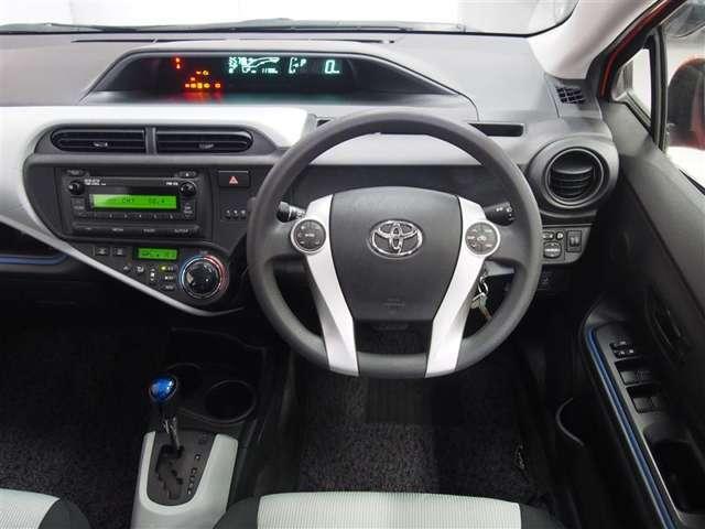 Toyota Aqua used car 2013 model Orange color photo: Cockpit view (Driver view)
