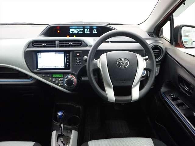 Toyota Aqua used car 2014 model Orange color photo: Cockpit view (Driver view)