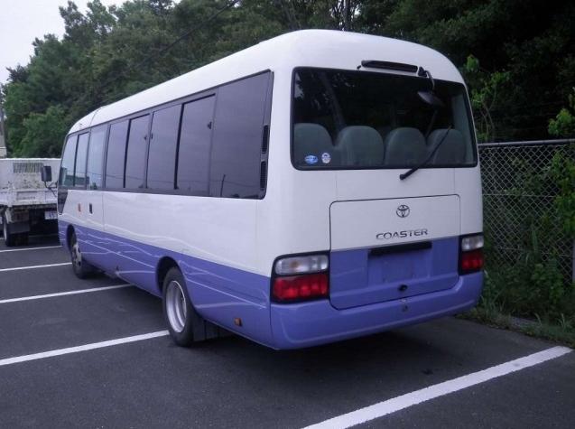 Used Toyota Coaster Bus photo: 2014 model White and Lavender Two Tone color - Back view