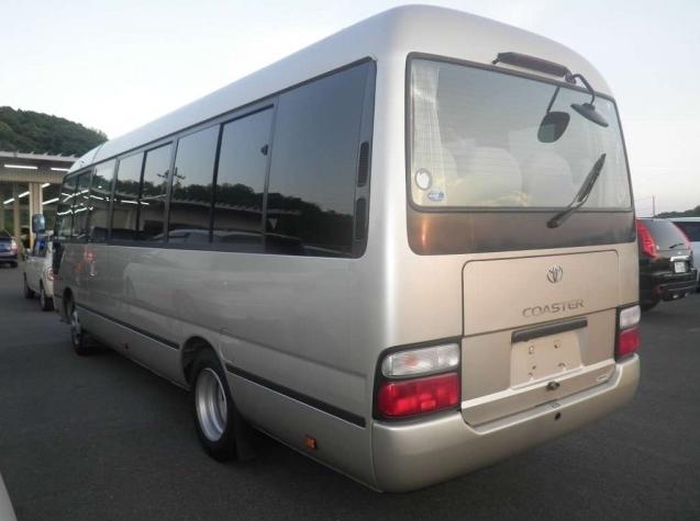Used Toyota Coaster Bus photo: 2015 model Gold color - Back view