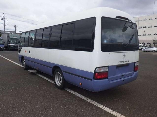 Used Toyota Coaster Bus photo: 2016 model White and Lavender Two Tone color - Back view