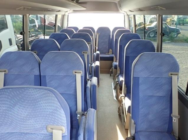Used Toyota Coaster Bus photo: 2016 model White and Lavender Two Tone color - Interior view